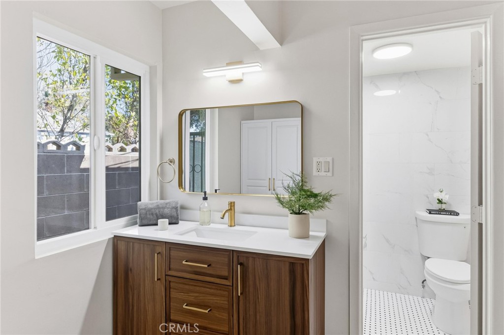 3328 North Verdugo Road Glendale, CA 91208 - Photo 29 of 42 a bathroom with a sink a toilet and a mirror