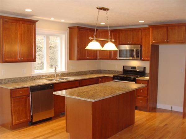53 Frankland Road Ashland, MA 01721 - Photo 3 of 17 a kitchen with stainless steel appliances granite countertop a sink a stove and a refrigerator