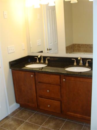 53 Frankland Road Ashland, MA 01721 - Photo 9 of 17 a bathroom with a granite countertop sink and a mirror
