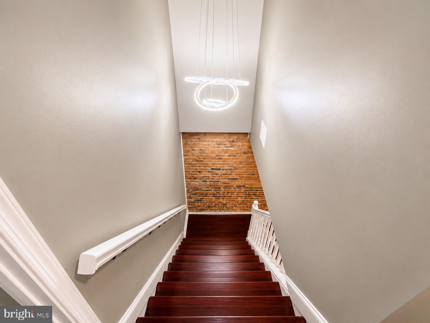 1610 Federal Street Baltimore, MD 21213 - Photo 10 of 27 Elegant staircase with modern lighting.