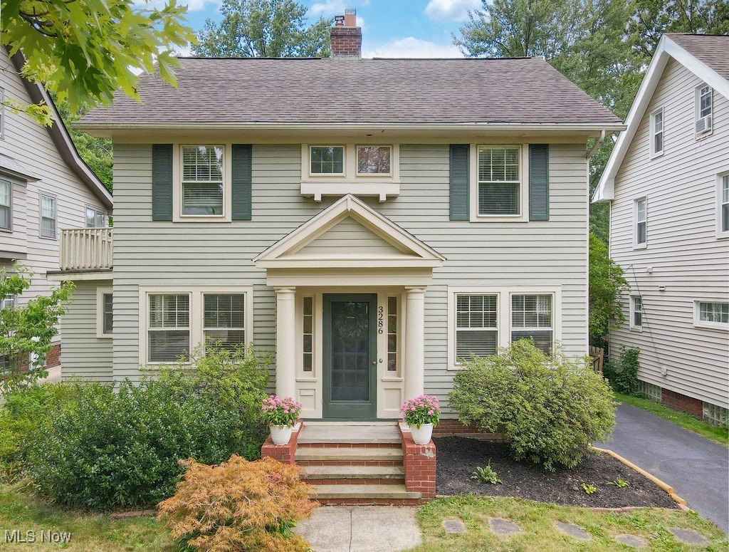 3286 Clarendon Road Cleveland, OH 44118 - Photo 1 of 41 Front exterior of Colonial home with landscaping and japanese maple.