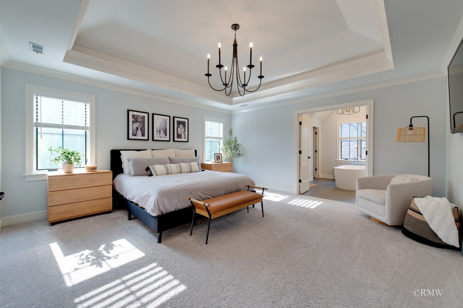 445 Broker Avenue Itasca, IL 60143 - Photo 13 of 16 a spacious bedroom with a bed chandelier and window