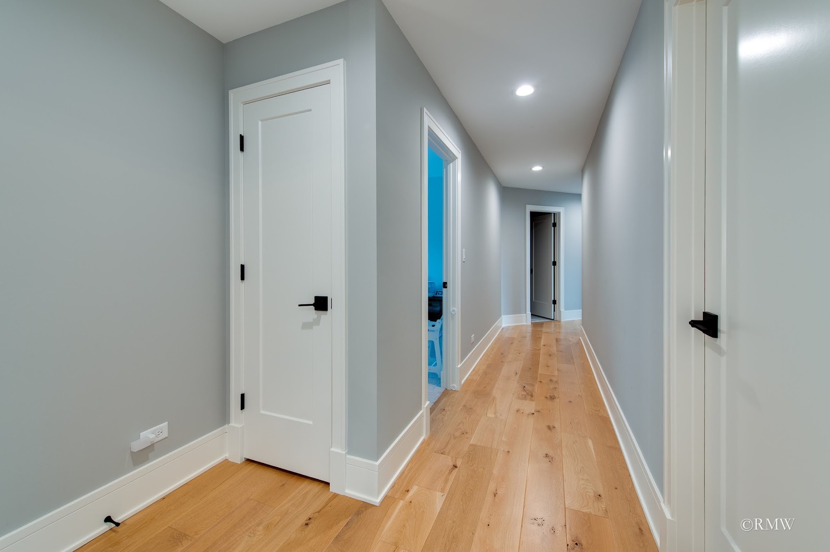 445 Broker Avenue Itasca, IL 60143 - Photo 16 of 16 a view of a hallway with wooden floor and a bathroom