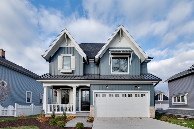 445 Broker Avenue Itasca, IL 60143 - Photo 2 of 16 a view of a house with a garage and balcony