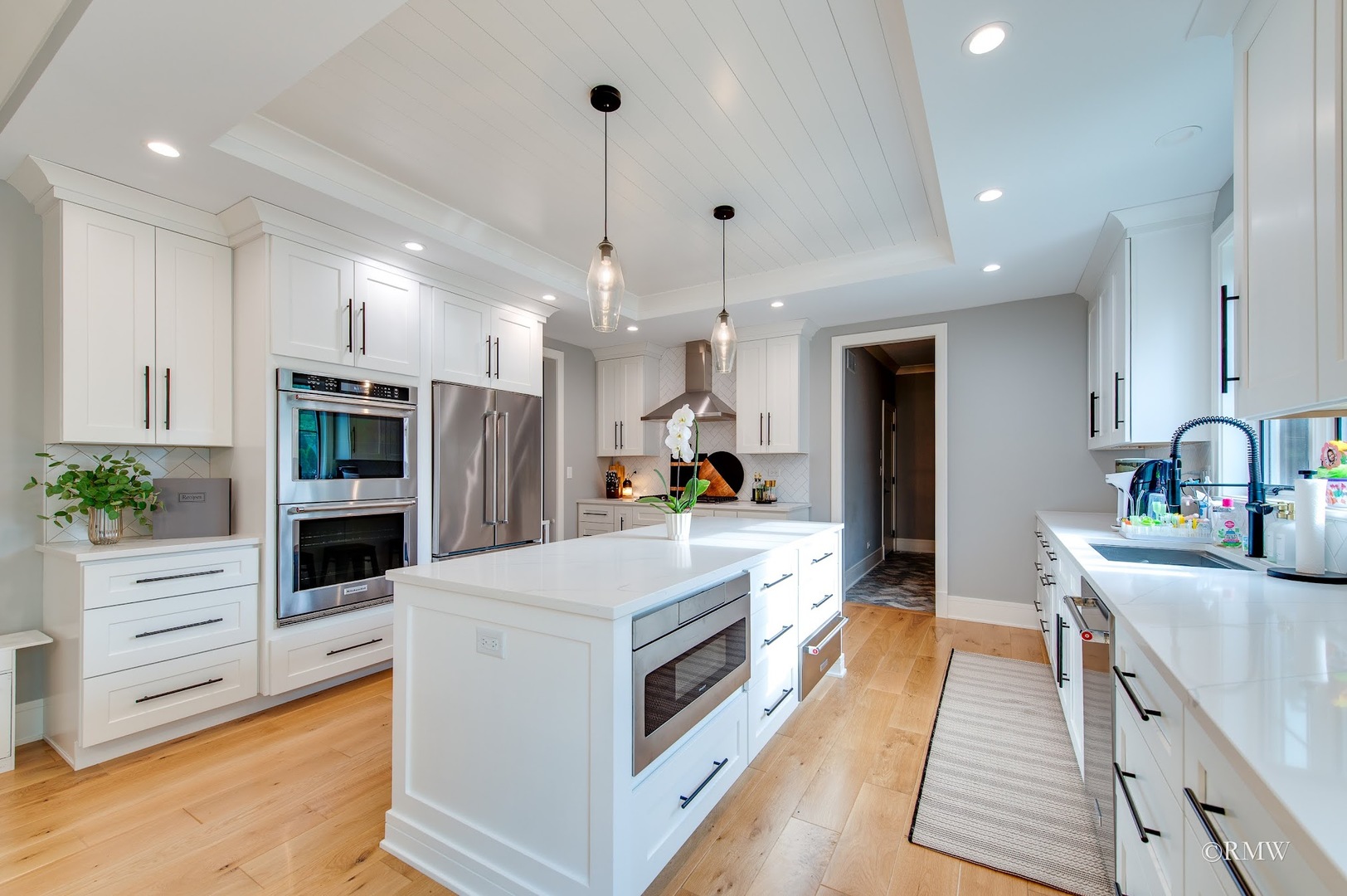 445 Broker Avenue Itasca, IL 60143 - Photo 5 of 16 a large kitchen with kitchen island a sink stainless steel appliances and cabinets
