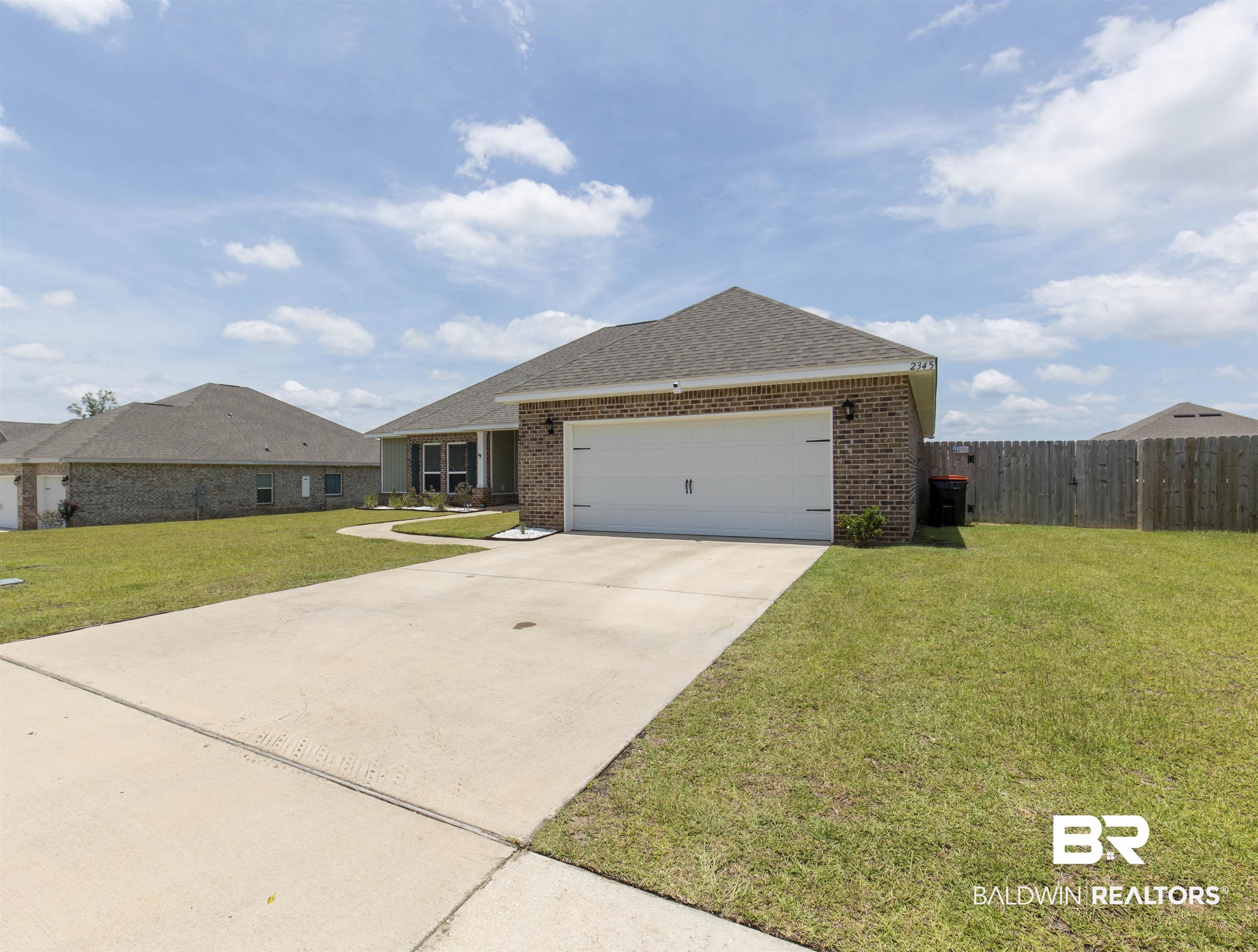 2345 Laurel Street Semmes, AL 36575 - Photo 30 of 31 Single story home featuring brick siding, a shingled roof, an attached garage, and concrete driveway