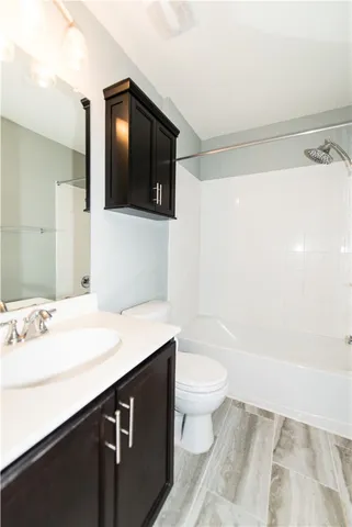 a bathroom with a sink a toilet and bathtub