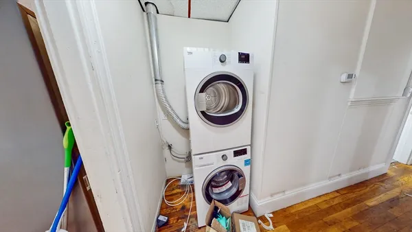a utility room with dryer and washer