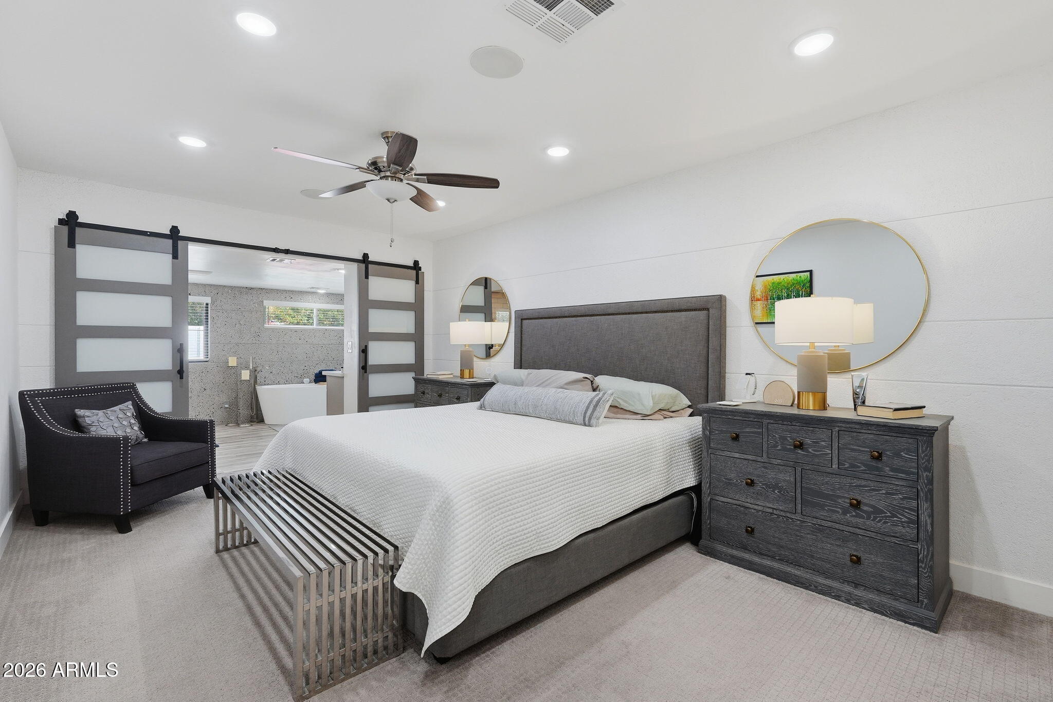 5149 North 34th Street Phoenix, AZ 85018 - Photo 29 of 70 a bedroom with a large bed and a chandelier