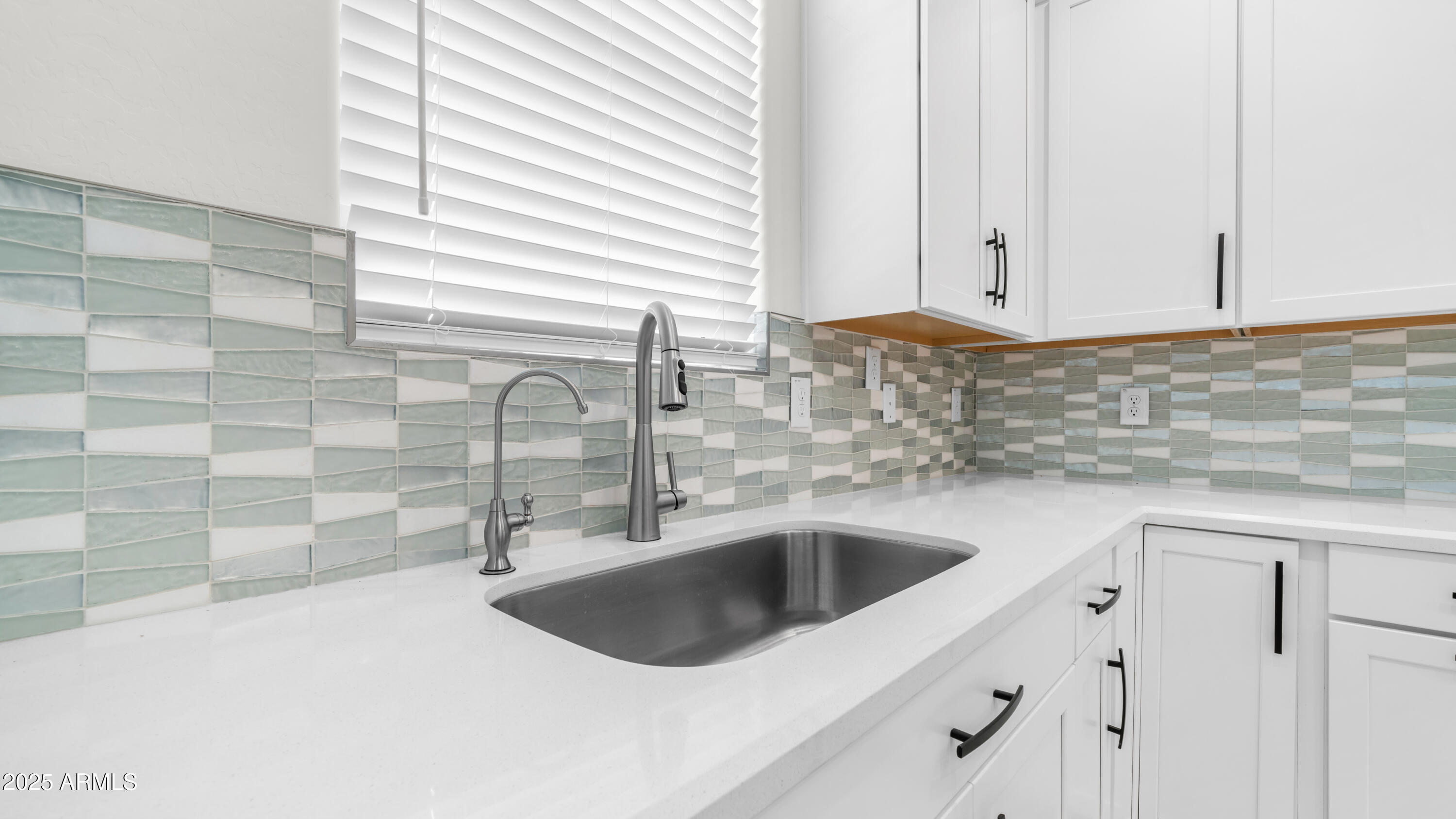 13359 West Eagle Feather Road Peoria, AZ 85383 - Photo 11 of 33 a close view of a sink and dishwasher in a kitchen