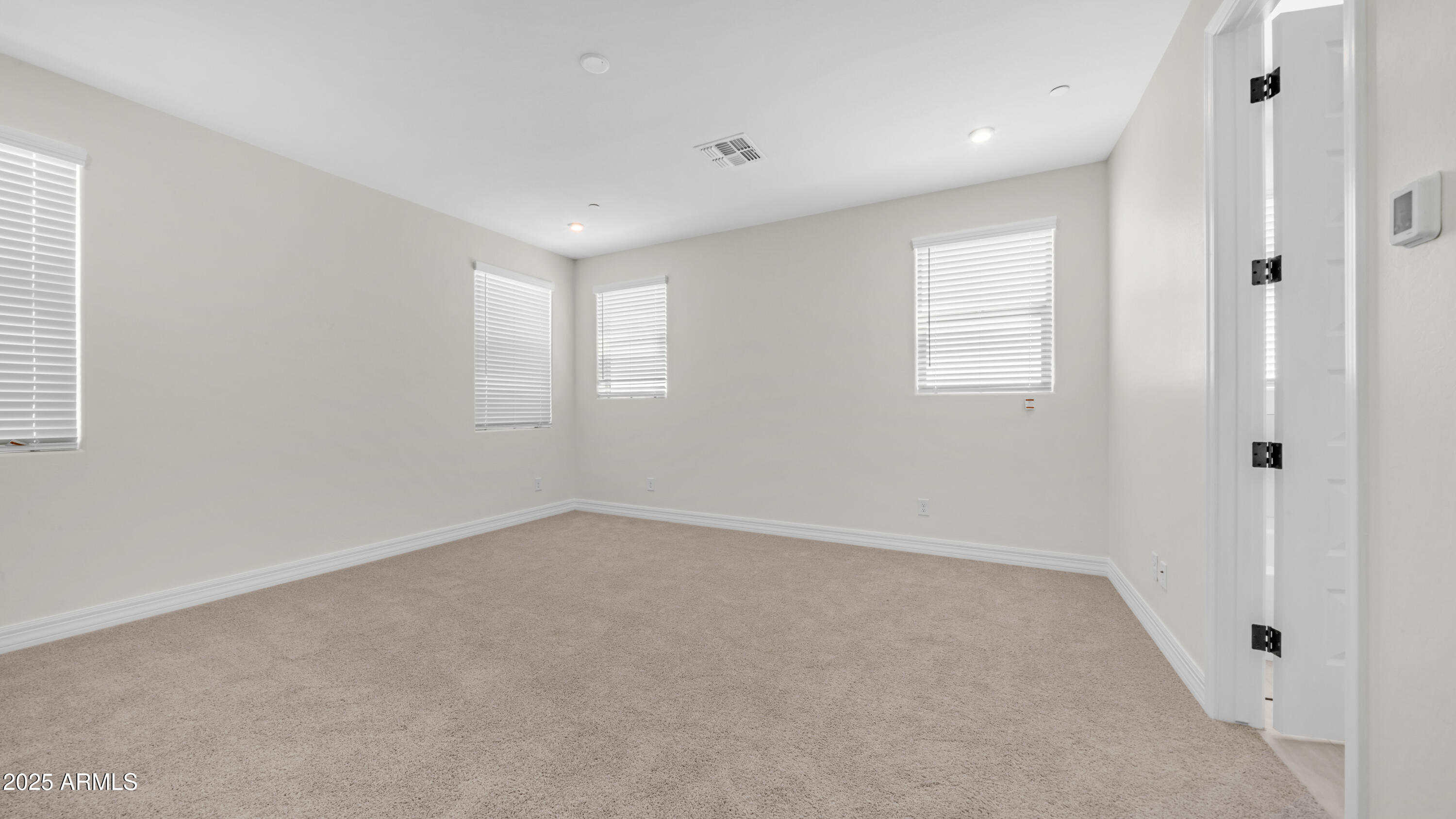 13359 West Eagle Feather Road Peoria, AZ 85383 - Photo 16 of 33 an empty room with windows