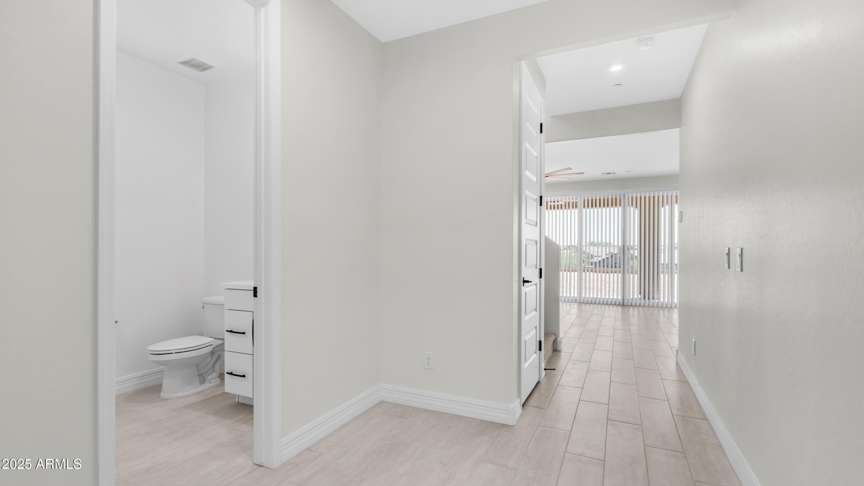 13359 West Eagle Feather Road Peoria, AZ 85383 - Photo 2 of 33 a bathroom with a toilet and a shower