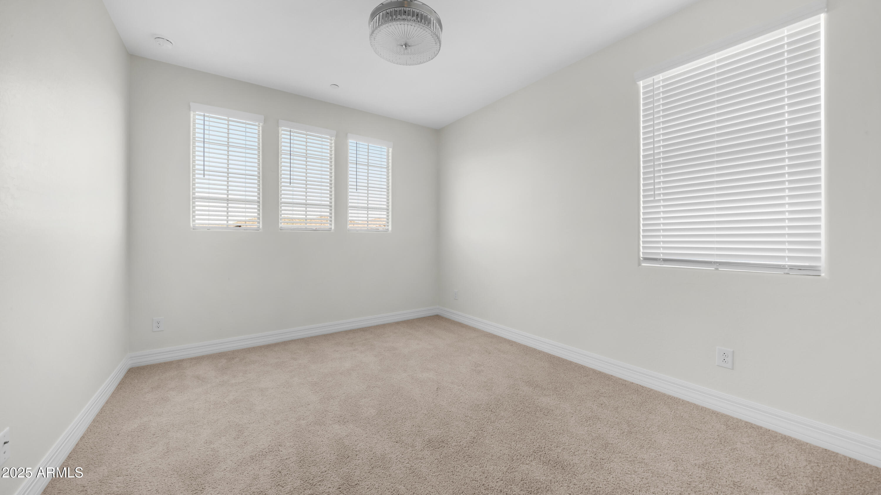 13359 West Eagle Feather Road Peoria, AZ 85383 - Photo 21 of 33 an empty room with a window