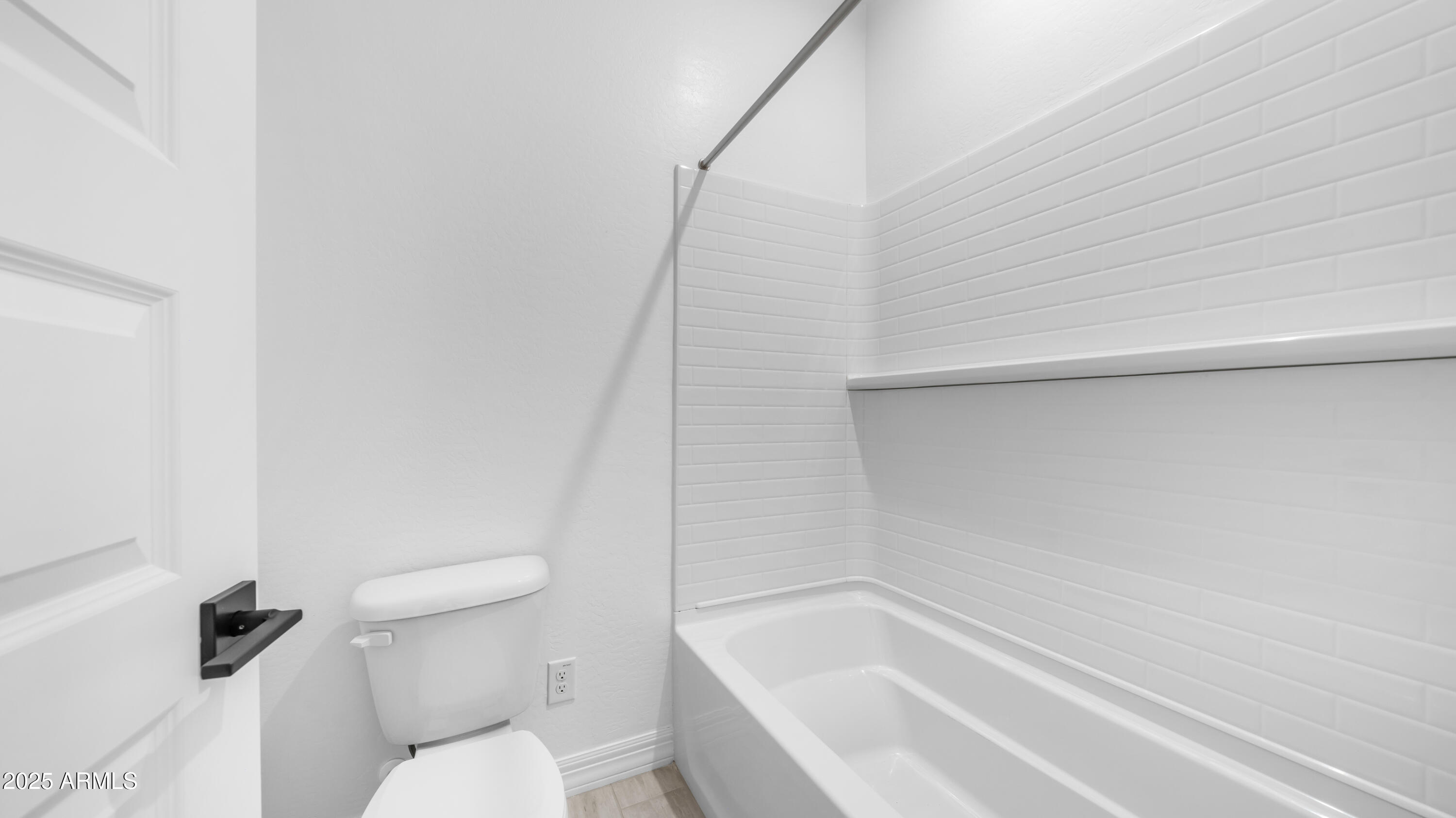 13359 West Eagle Feather Road Peoria, AZ 85383 - Photo 25 of 33 a bathroom with a toilet and a bathtub
