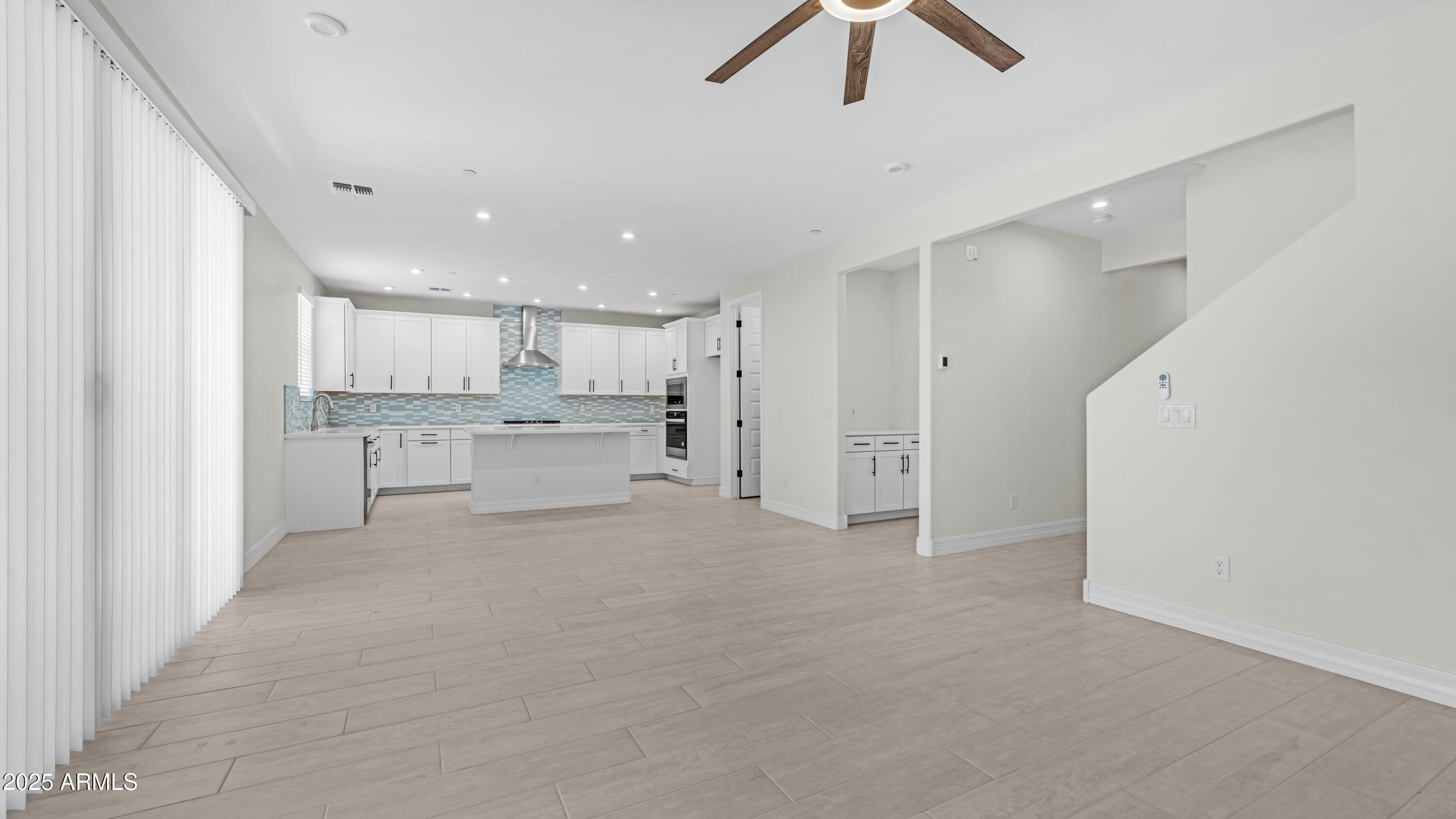 13359 West Eagle Feather Road Peoria, AZ 85383 - Photo 7 of 33 a view of a kitchen with refrigerator and window