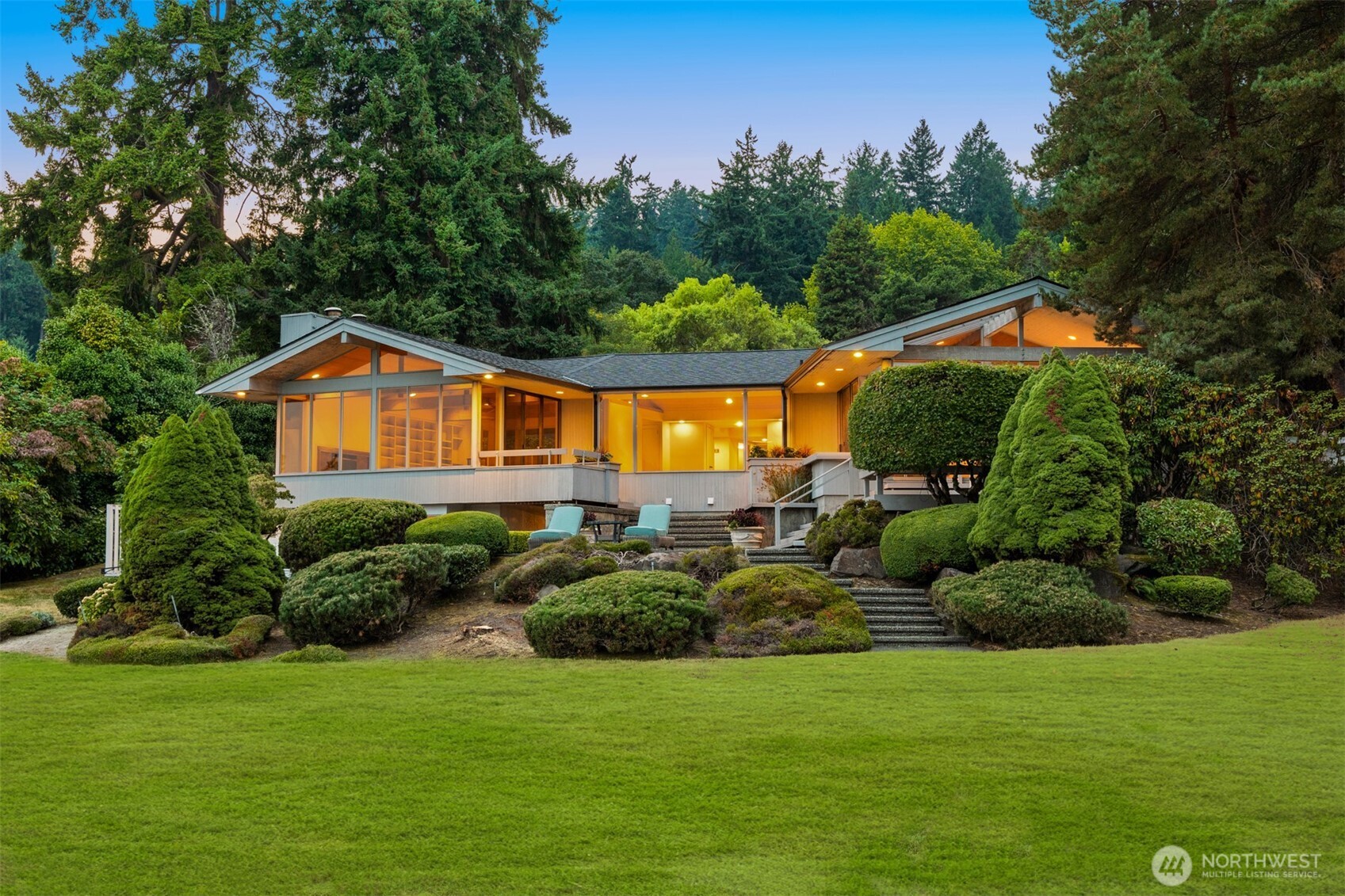 4802 East Mercer Way Mercer Island, WA 98040 - Photo 17 of 33 a backyard of a house with lots of green space and lake view