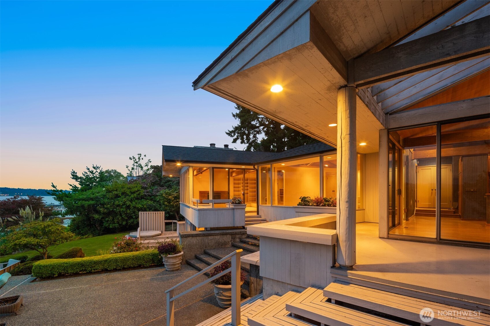 4802 East Mercer Way Mercer Island, WA 98040 - Photo 19 of 33 a view of a lobby with a floor to ceiling window and potted plants