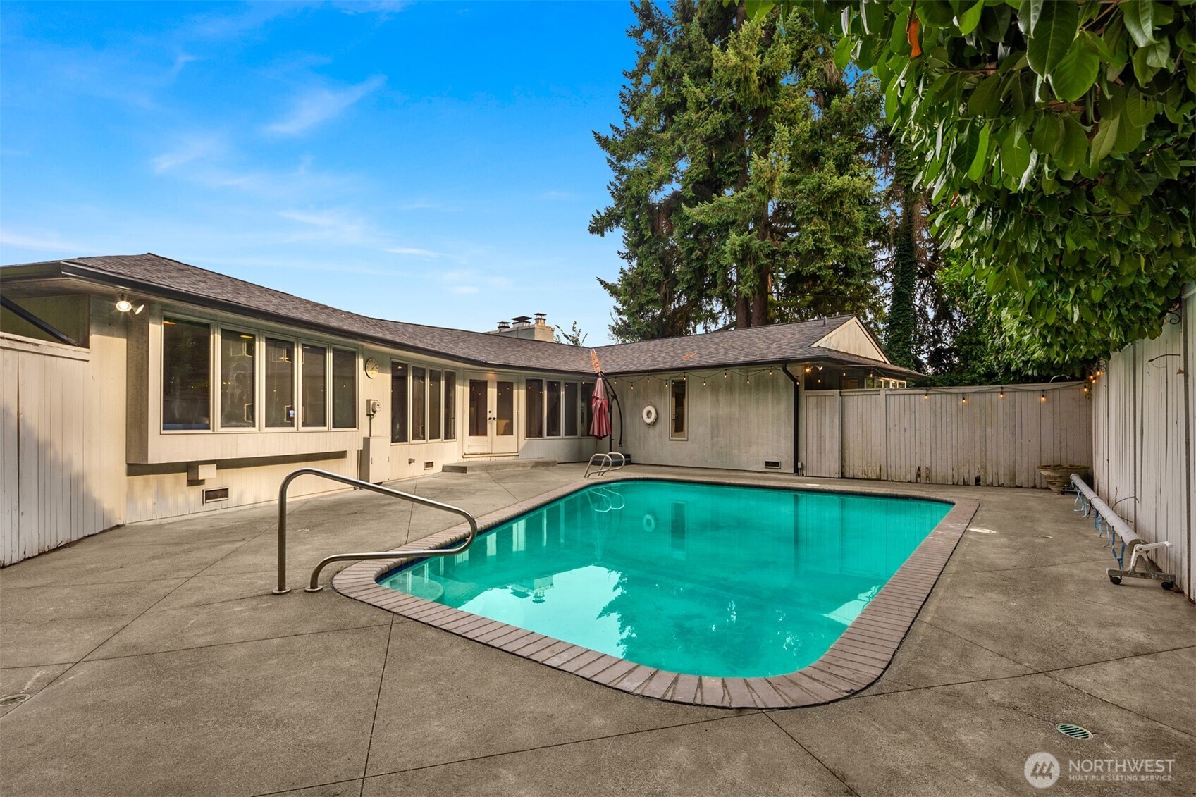 4802 East Mercer Way Mercer Island, WA 98040 - Photo 30 of 33 a view of a house with a small yard and wooden fence