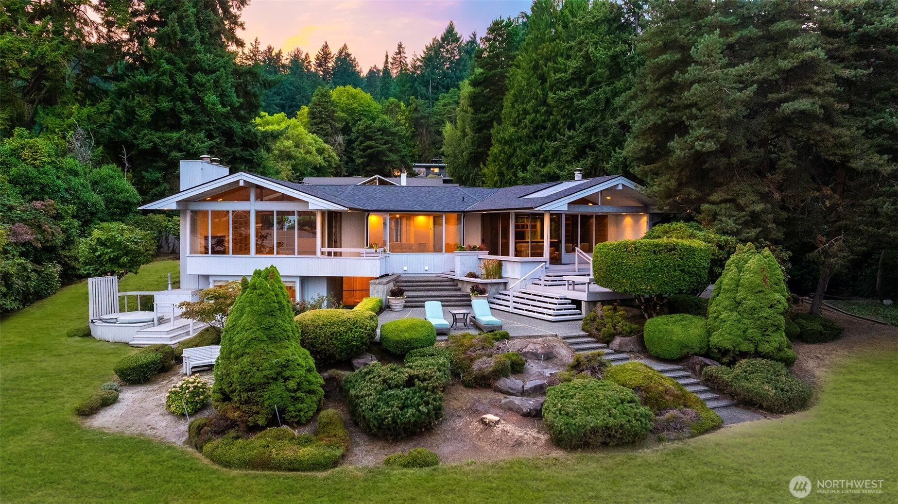 4802 East Mercer Way Mercer Island, WA 98040 - Photo 8 of 33 a front view of a house with a yard and potted plants