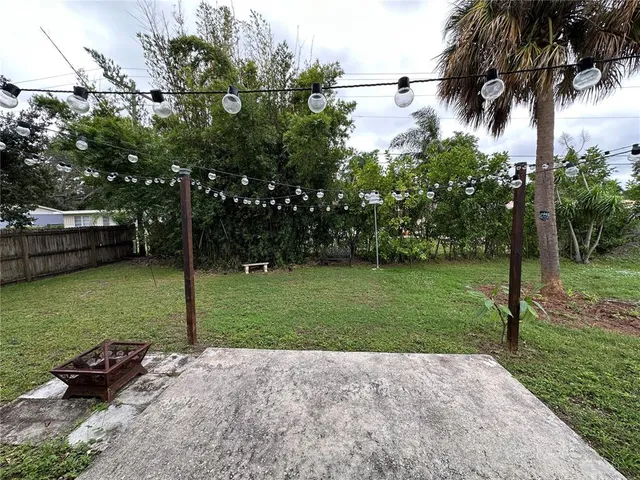 a view of a wooden deck with a yard