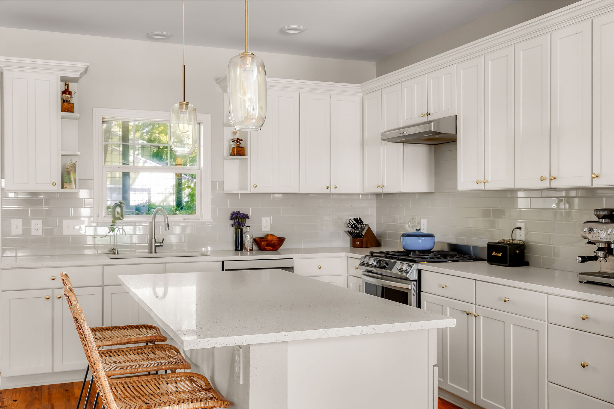 5108 Eilers Avenue Austin, TX 78751 - Photo 12 of 39 Fully updated kitchen with quartz countertops, ample storage, and a spacious island with seating.