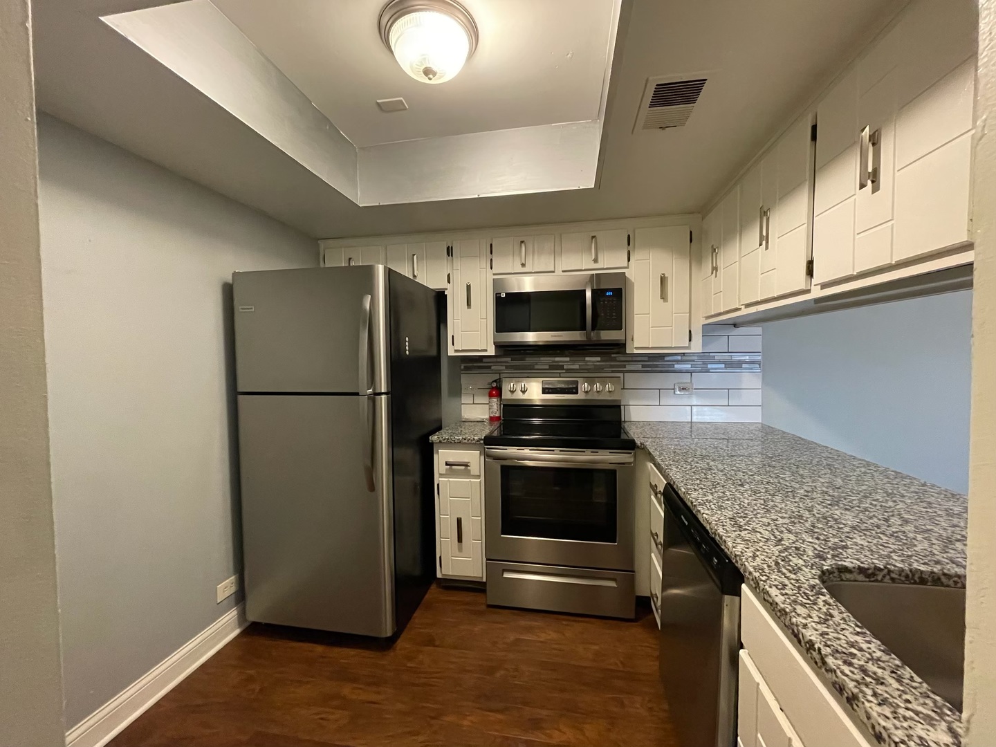 830 Elder Road, Unit B303 Homewood, IL 60430 - Photo 4 of 6 a kitchen with a refrigerator sink and microwave