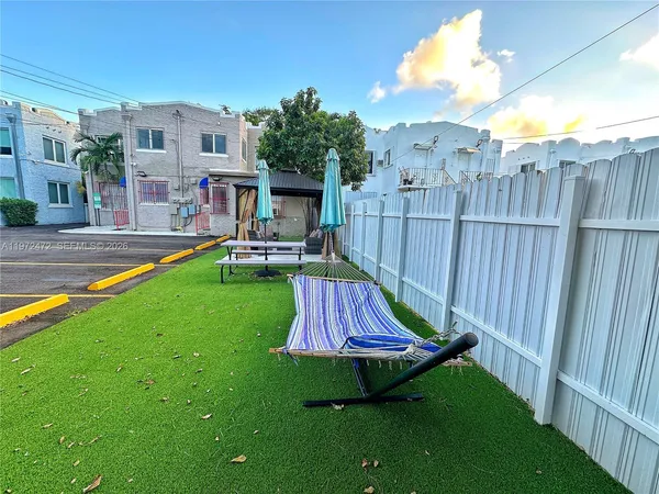 a view of a dinning table and chairs in the patio