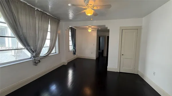 an entryway in a hall with a window