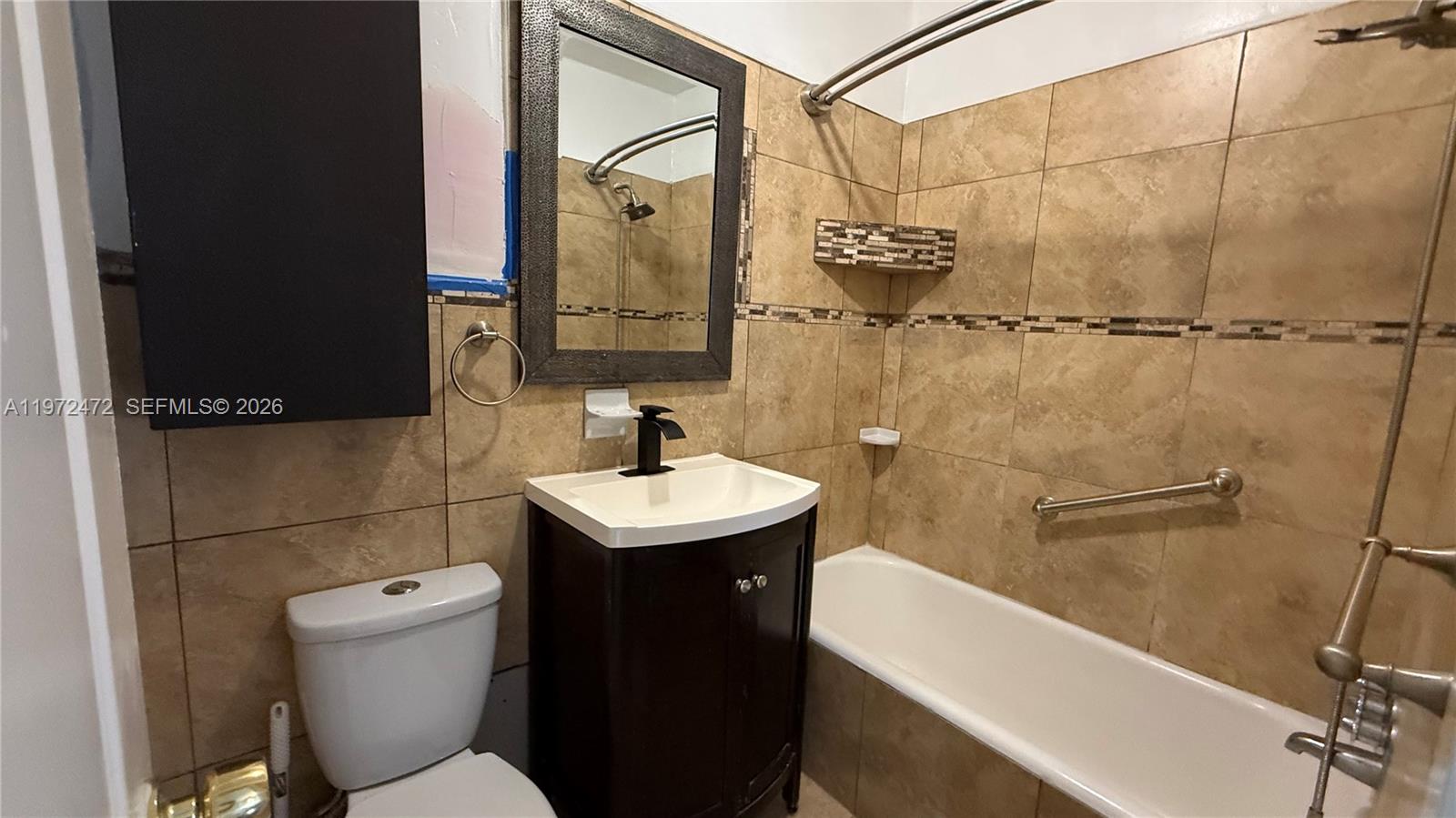 2153 Southwest 14th Terrace, Unit 4 Miami, FL 33145 - Photo 9 of 14 a bathroom with a sink toilet and shower