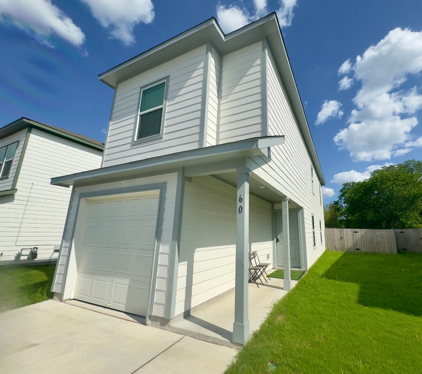 a front view of a house with a yard