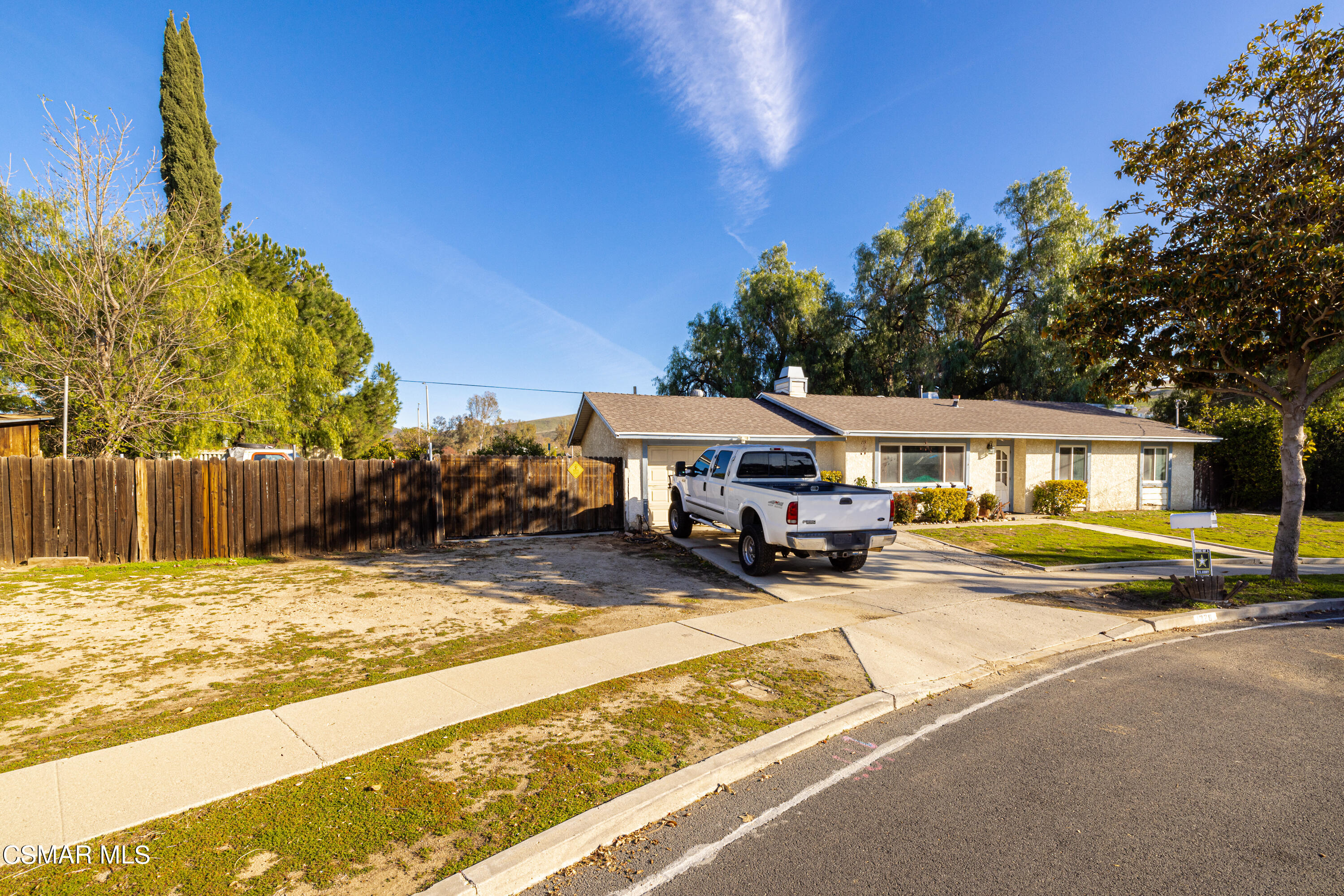a view of a house with swimming pool and sitting area