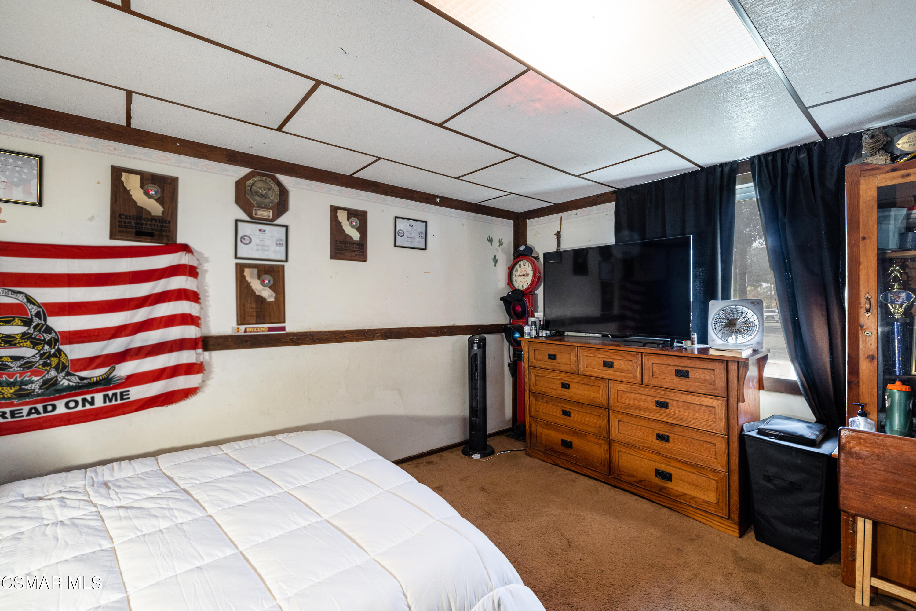 1328 Olympic Street Simi Valley, CA 93063 - Photo 14 of 23 a bedroom with furniture and a flat screen tv