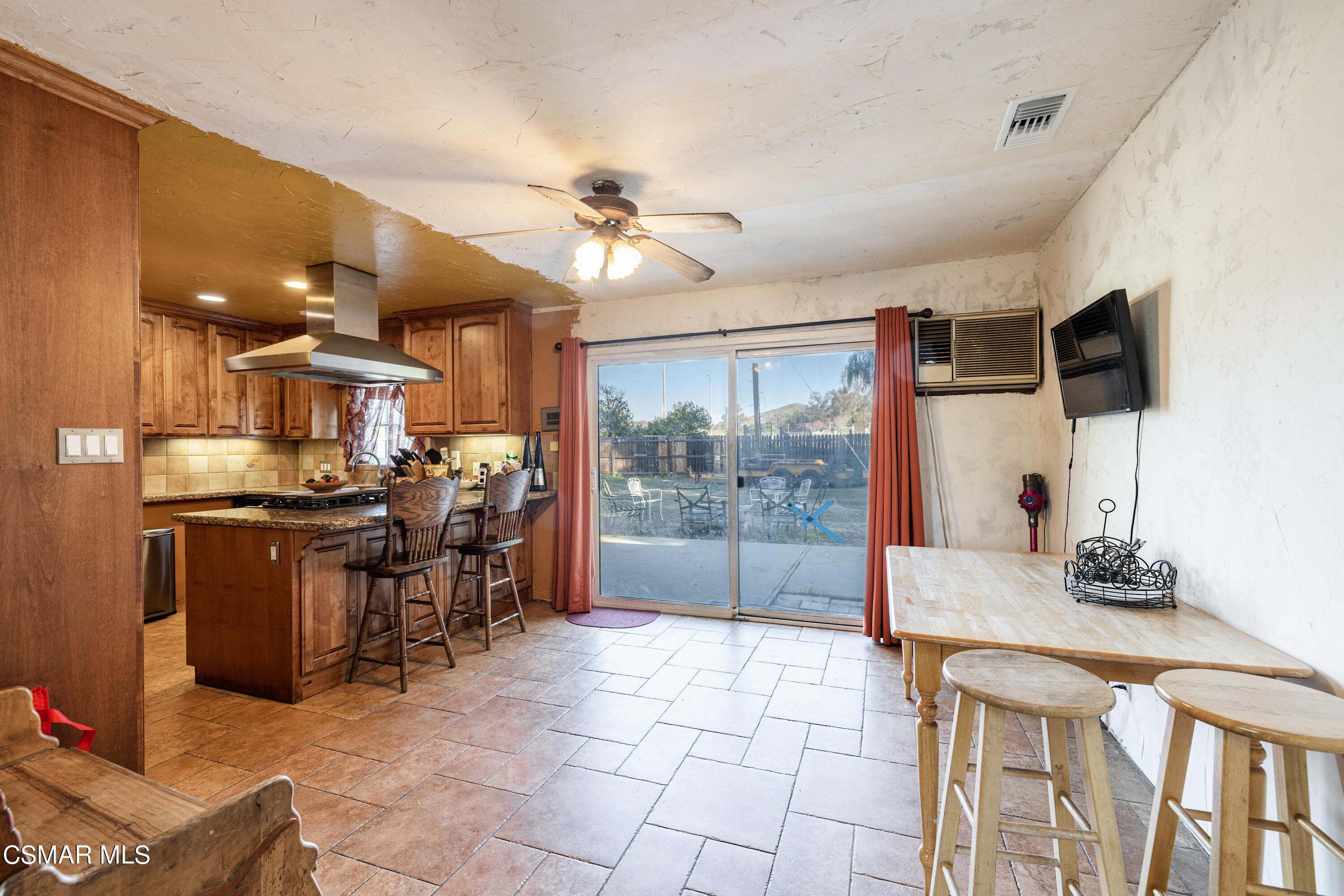 1328 Olympic Street Simi Valley, CA 93063 - Photo 5 of 23 a open kitchen with stainless steel appliances granite countertop a sink and a refrigerator