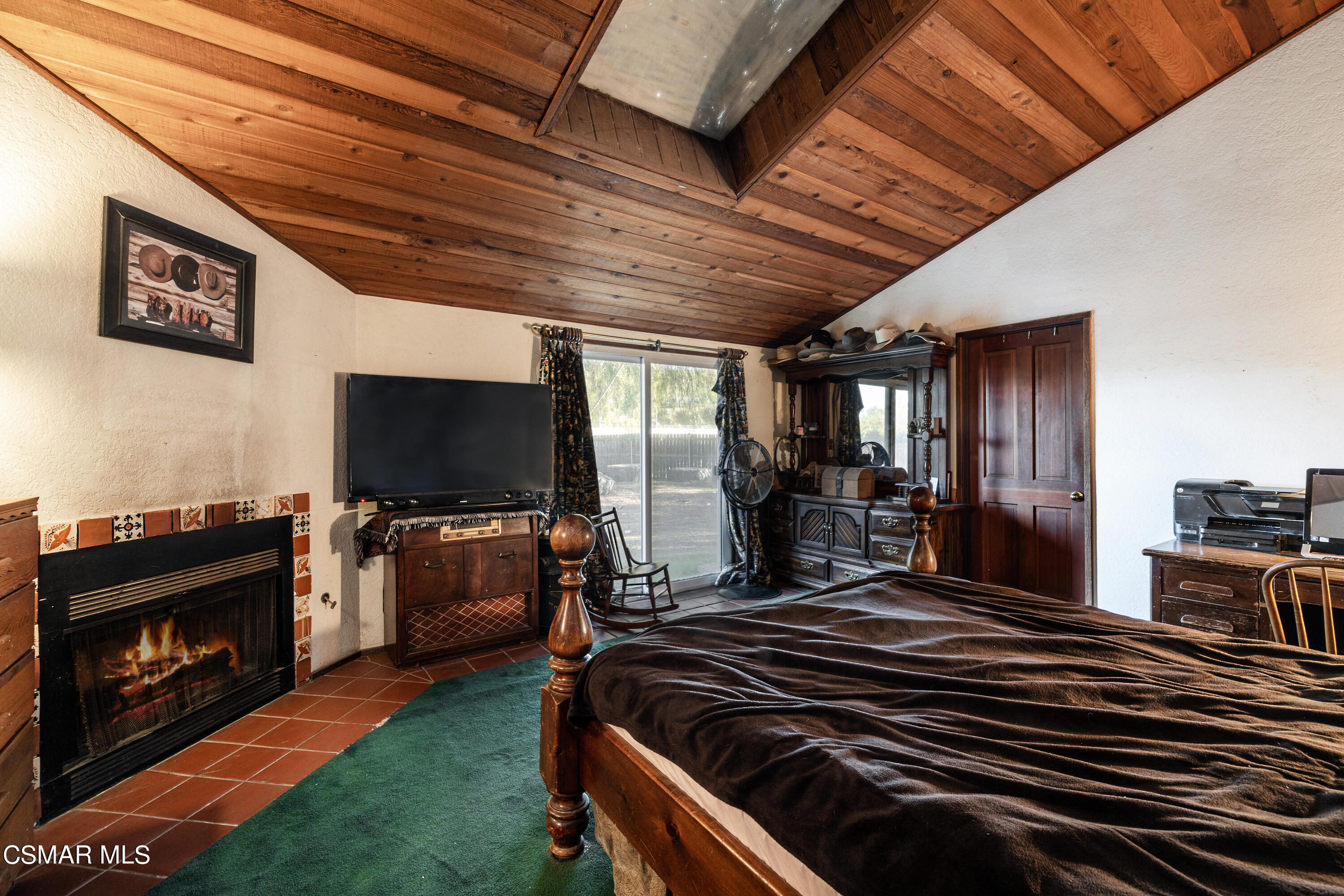 1328 Olympic Street Simi Valley, CA 93063 - Photo 8 of 23 a spacious bedroom with a bed and a flat screen tv