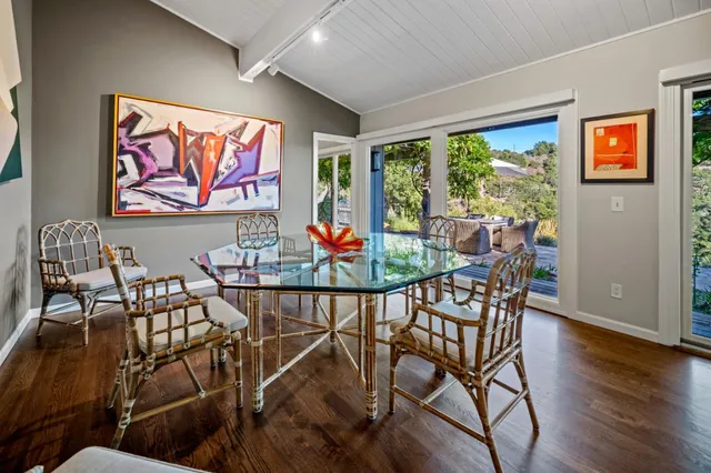 an outdoor space with furniture and wooden floor