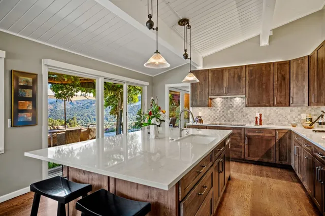 a kitchen with stainless steel appliances granite countertop counter space a sink and cabinets