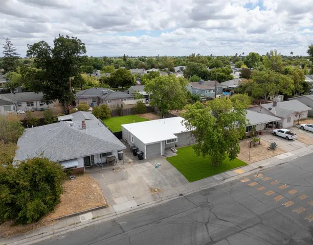 an aerial view of a house with a garden