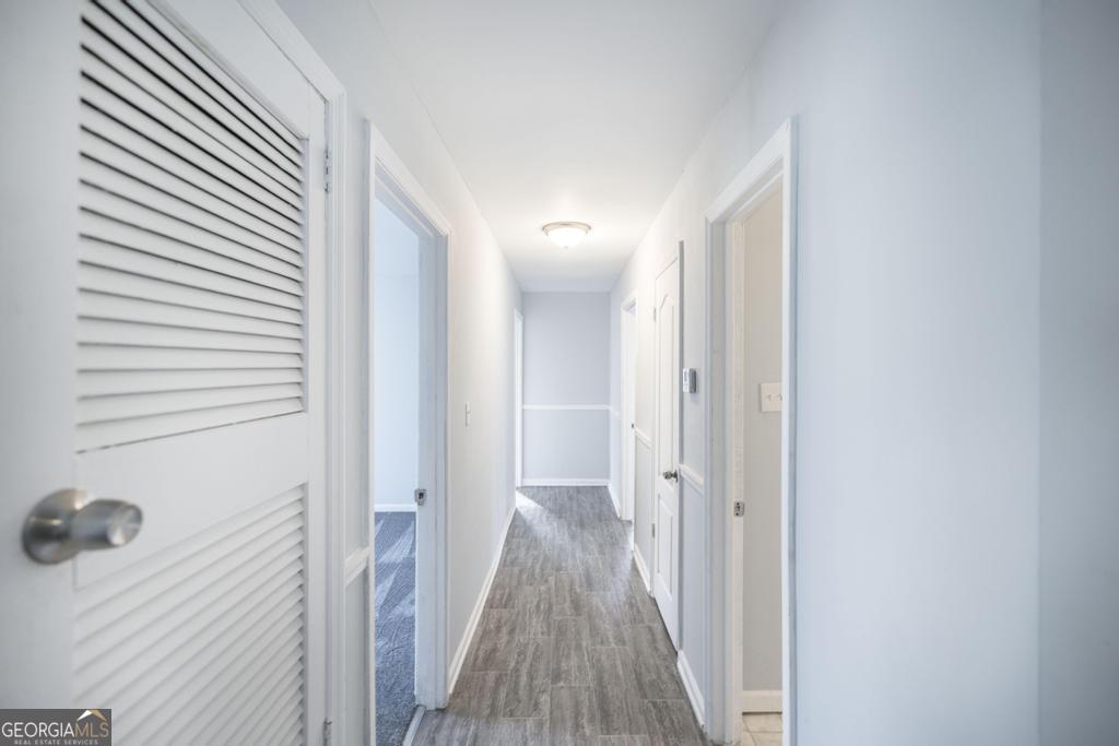 918 Henderson Street Dublin, GA 31021 - Photo 15 of 23 a view of a hallway with wooden floor