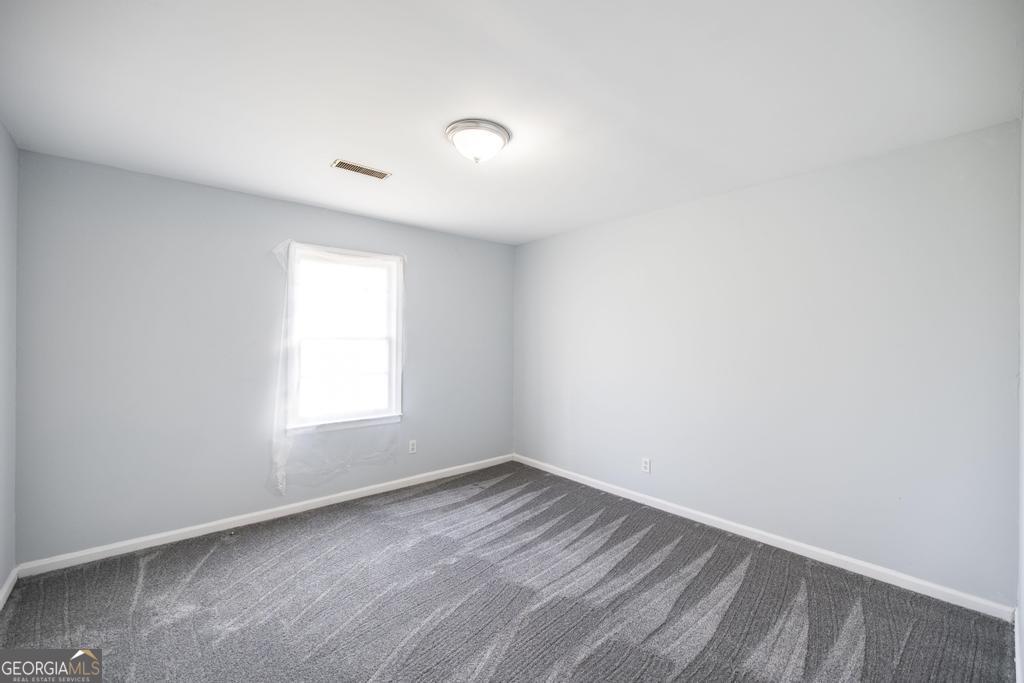 918 Henderson Street Dublin, GA 31021 - Photo 16 of 23 an empty room with a window