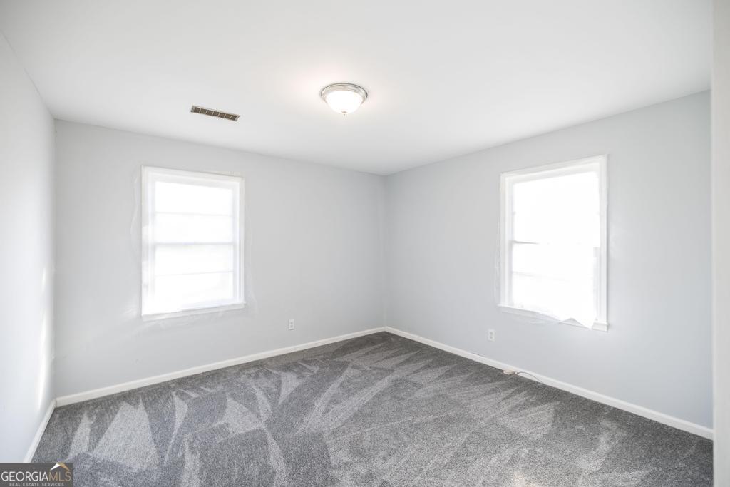 918 Henderson Street Dublin, GA 31021 - Photo 19 of 23 an empty room with a window