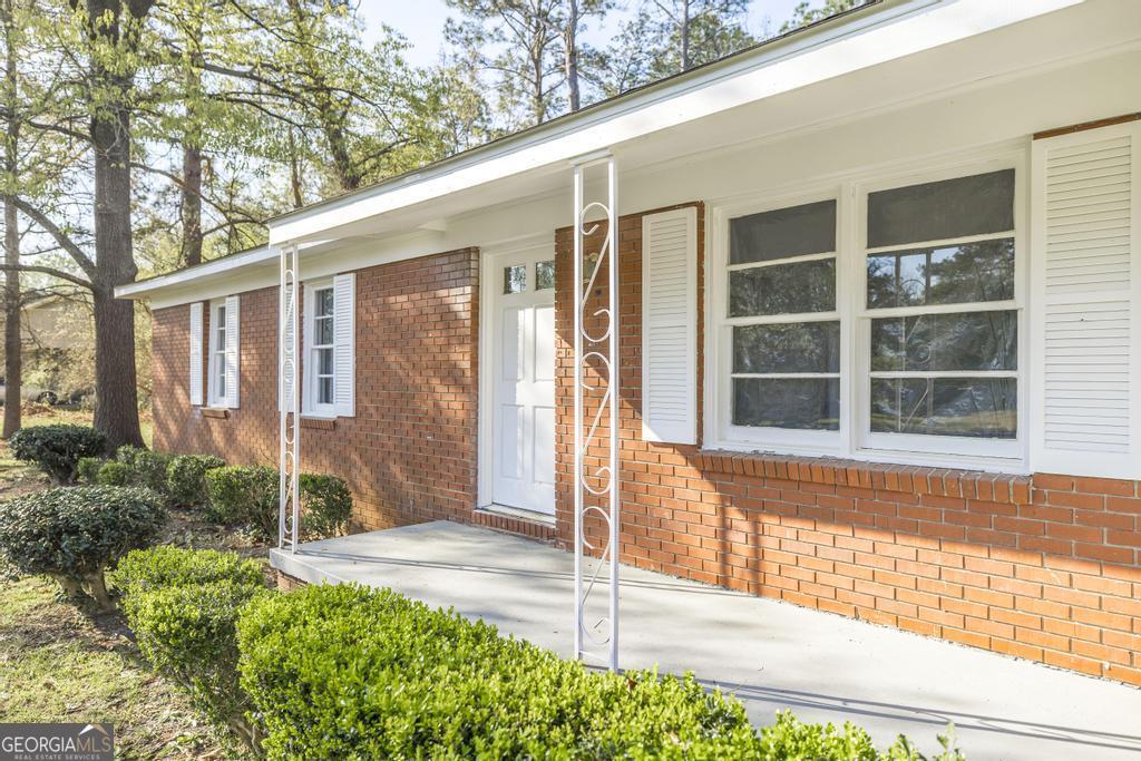 918 Henderson Street Dublin, GA 31021 - Photo 6 of 23 a view of a house with a backyard