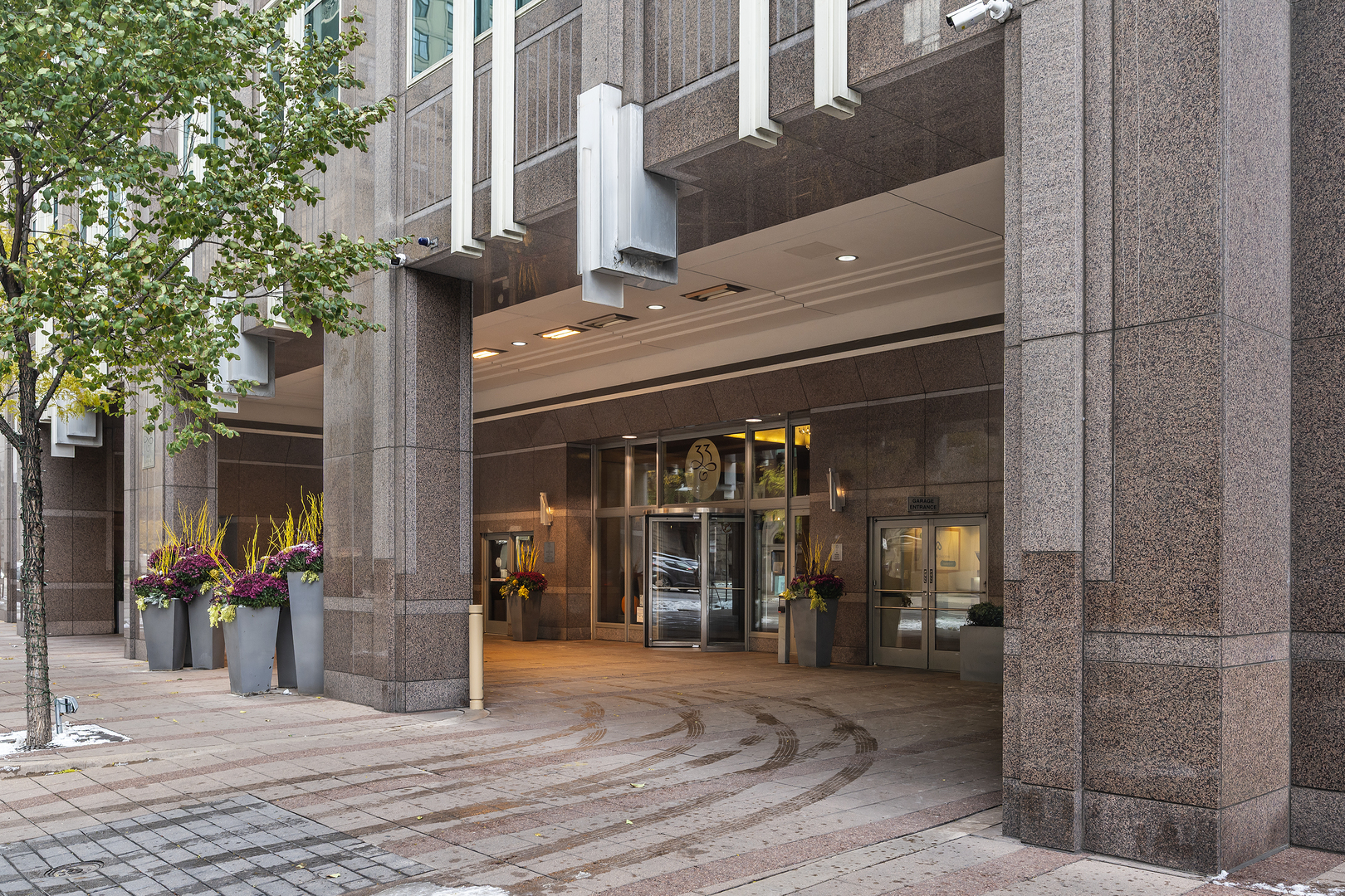 a view of a building with door and outdoor seating