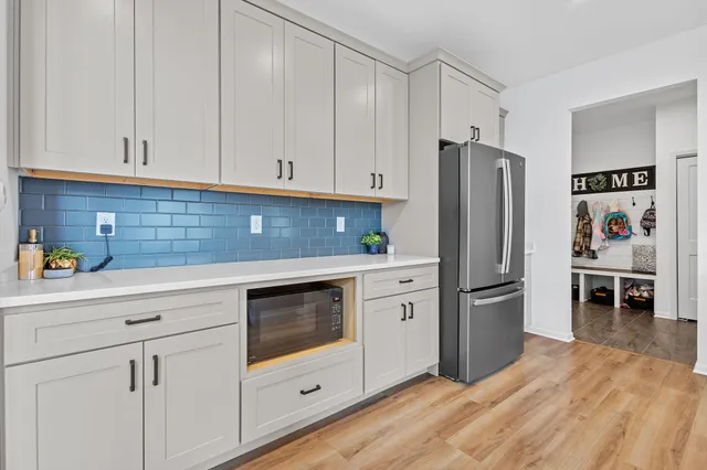 a kitchen with stainless steel appliances granite countertop a sink and stove