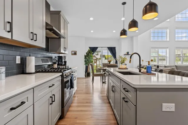 a view of kitchen with cabinets and wooden floor