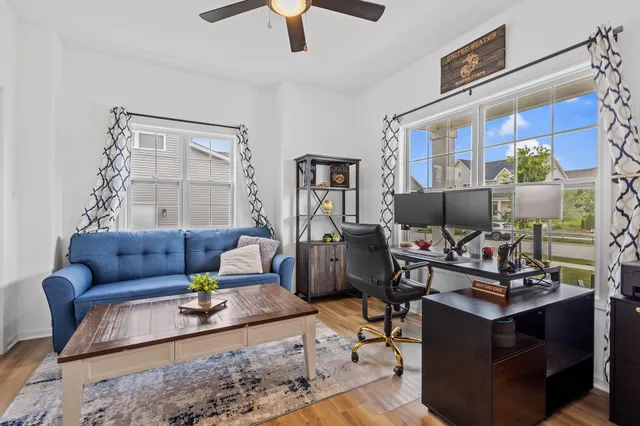 a view of a house with swimming pool and sitting area