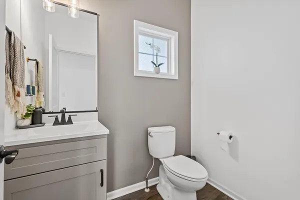 a view of a house with swimming pool and sitting area