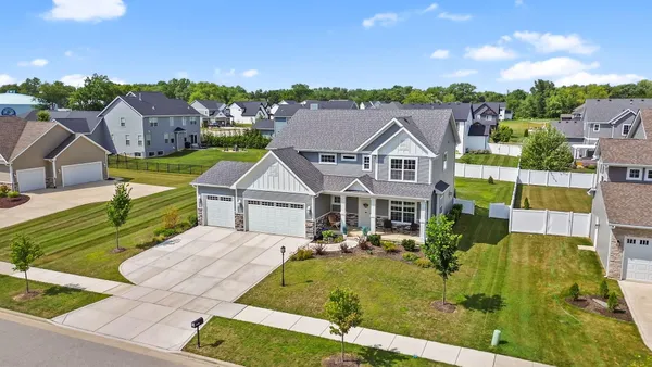 a view of a house with potted plants