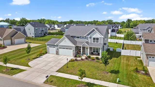 a view of a house with potted plants