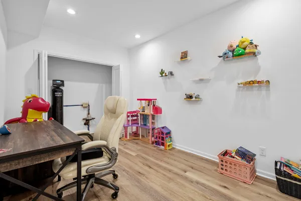 a view of a swimming pool and lounge chairs