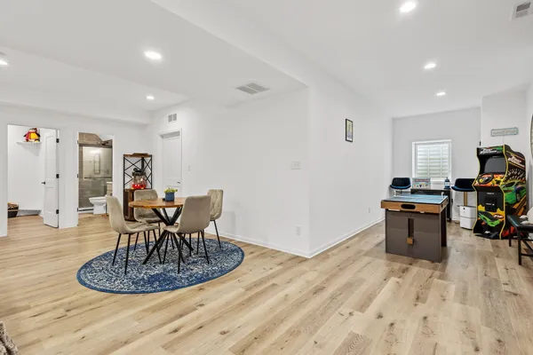 a front view of a house with a yard outdoor seating and garage